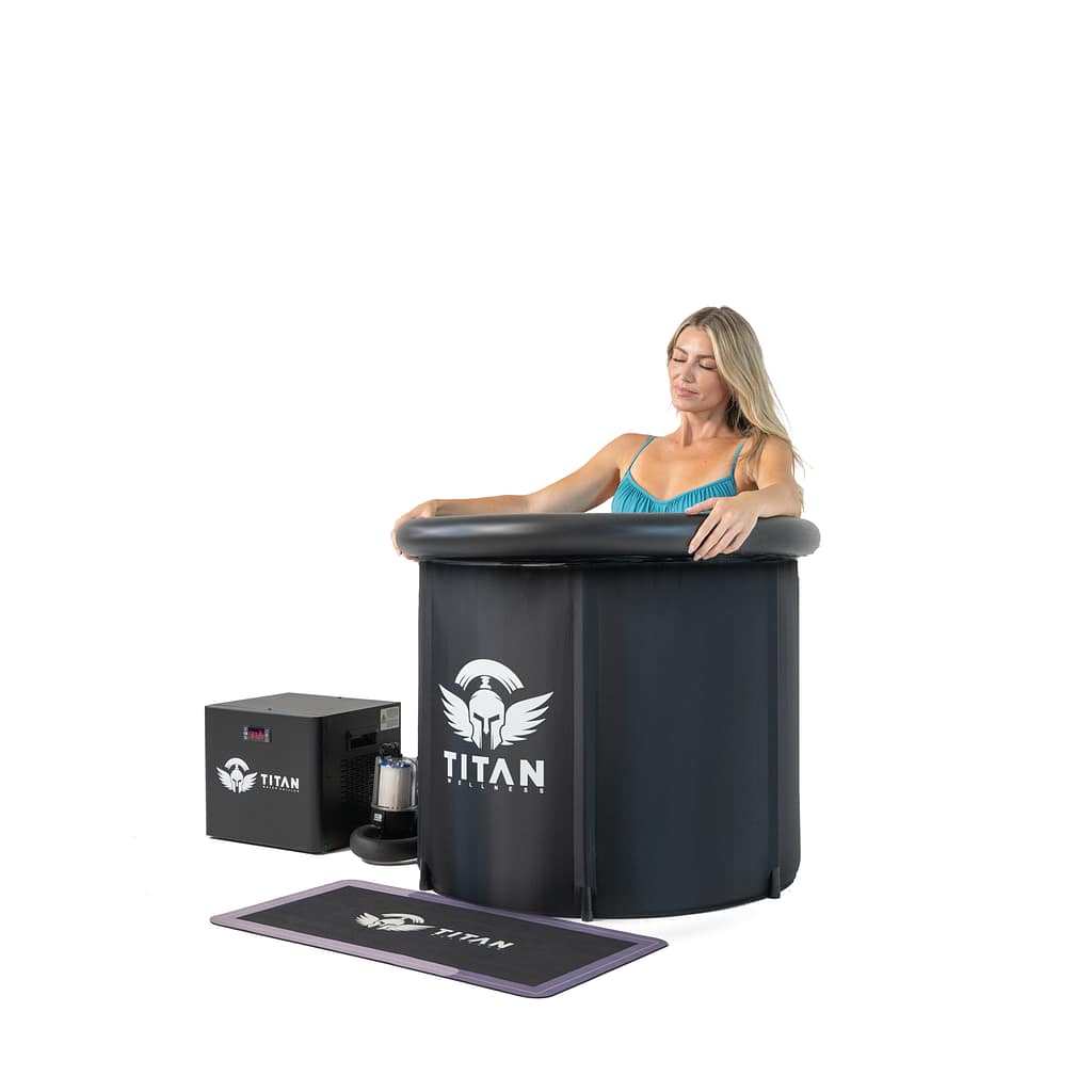 Person enjoying an ice bath in a Titan Wellness cold plunge tub with integrated water chiller.